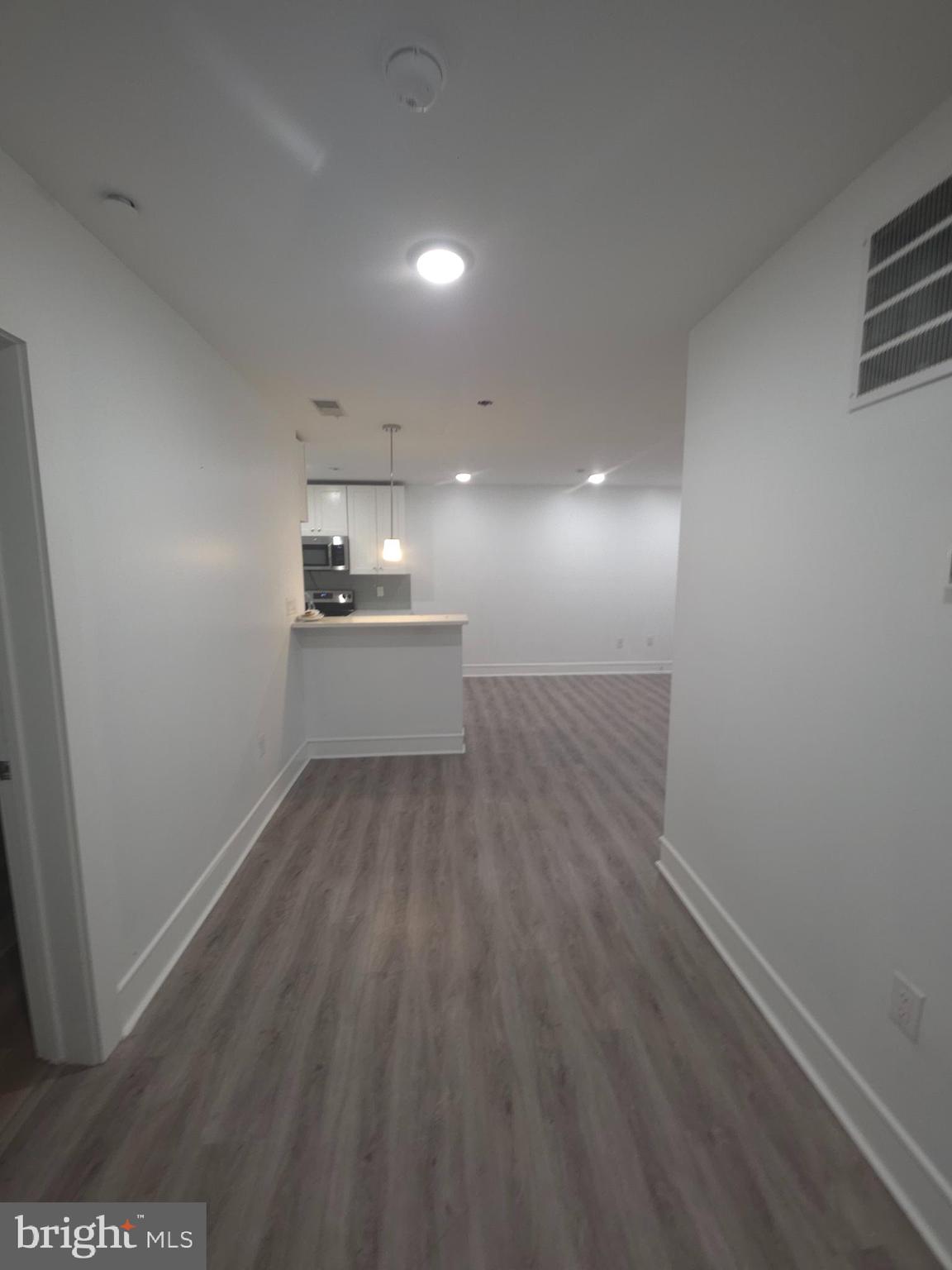 3925 Haverford Avenue, Unit LL2 Philadelphia, PA 19104 - Photo 31 of 38 a view of a kitchen with a sink and dishwasher wooden floor