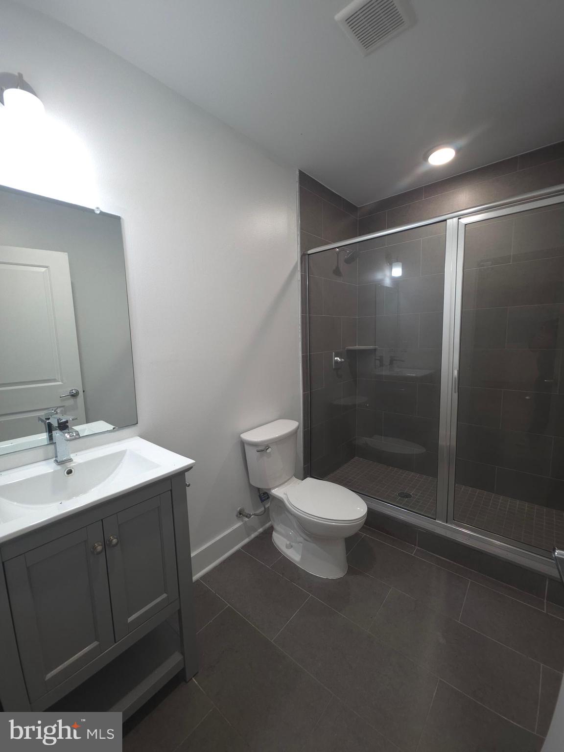 3925 Haverford Avenue, Unit LL2 Philadelphia, PA 19104 - Photo 36 of 38 a bathroom with a toilet sink and shower