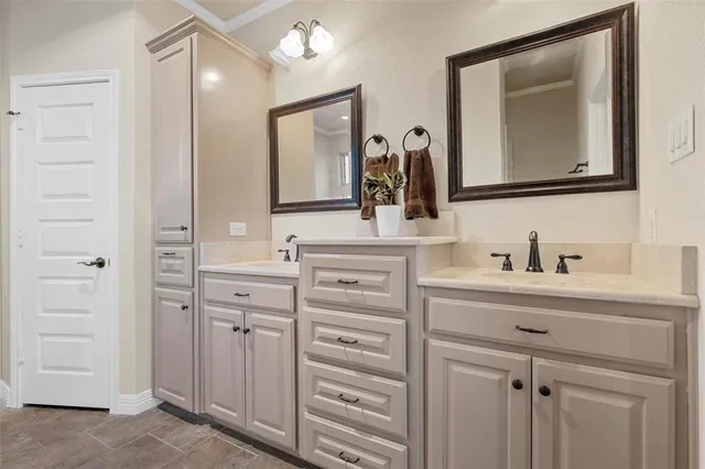 a bathroom with a sink vanity and a mirror