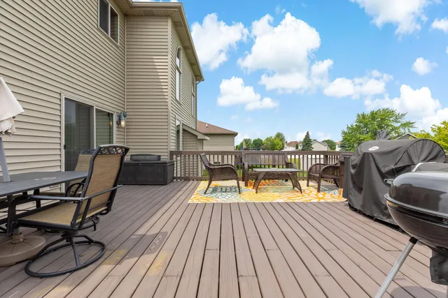 a view of a chairs on wooden deck