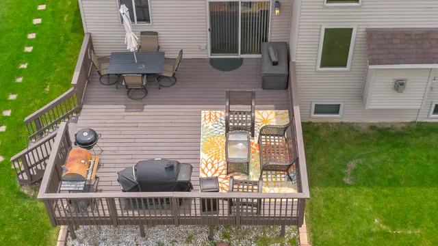 a view of balcony with two chairs and a table