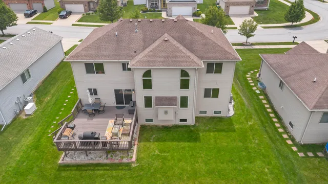 an aerial view of a house with a garden and patio