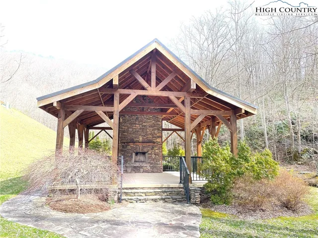 a view of a backyard with sitting area and garden