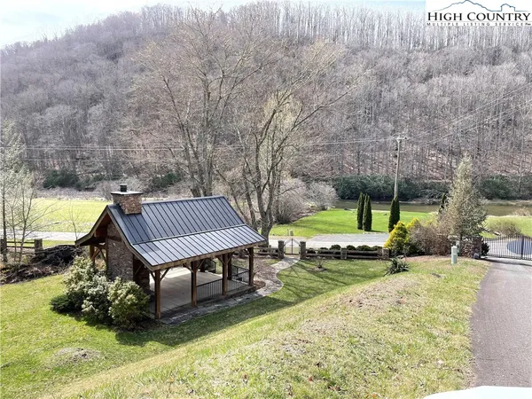 a bird bath tub sitting next to a dry yard
