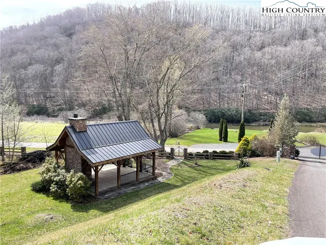 a bird bath tub sitting next to a dry yard