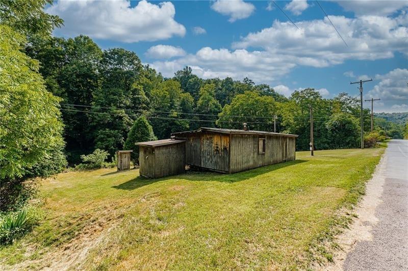 0 Toms Run Road Holbrook, PA 15352 - Photo 14 of 22 a view of a backyard with small cabin