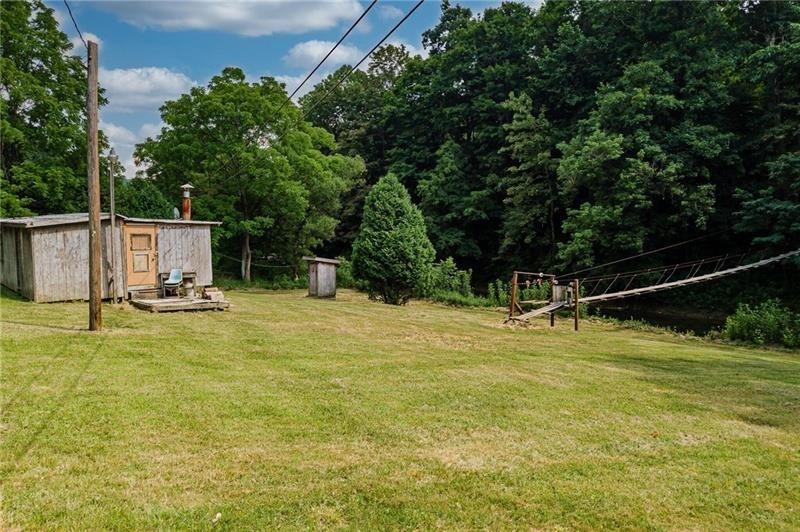 0 Toms Run Road Holbrook, PA 15352 - Photo 15 of 22 a view of a swimming pool with a house