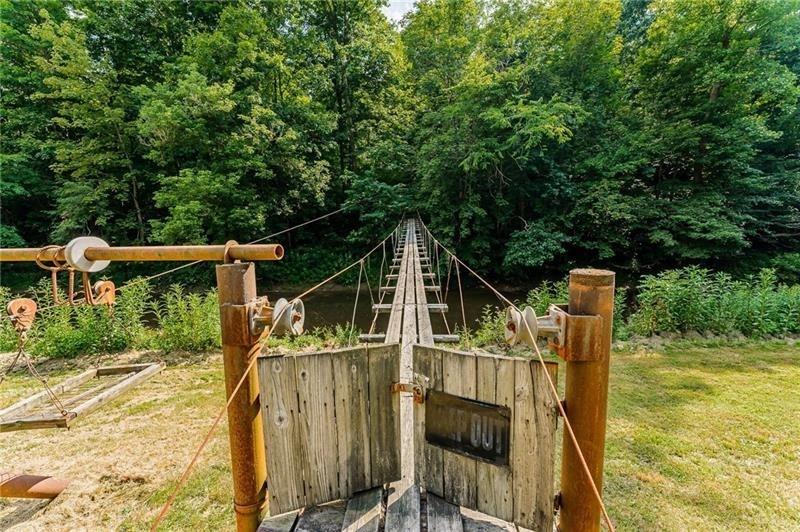 0 Toms Run Road Holbrook, PA 15352 - Photo 16 of 22 a view of a wooden deck and a backyard