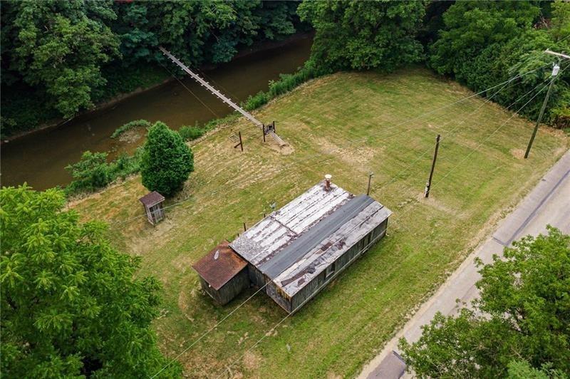 0 Toms Run Road Holbrook, PA 15352 - Photo 8 of 22 an aerial view of a house with swimming pool and a yard