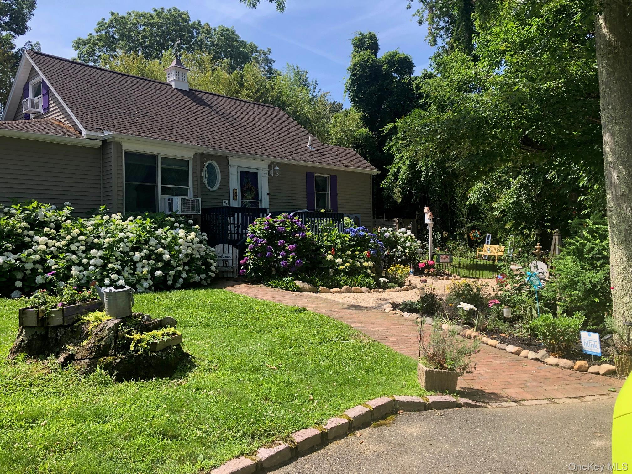 70 Shell Road Rocky Point, NY 11778 - Photo 2 of 31 View of front of home featuring roof with shingles