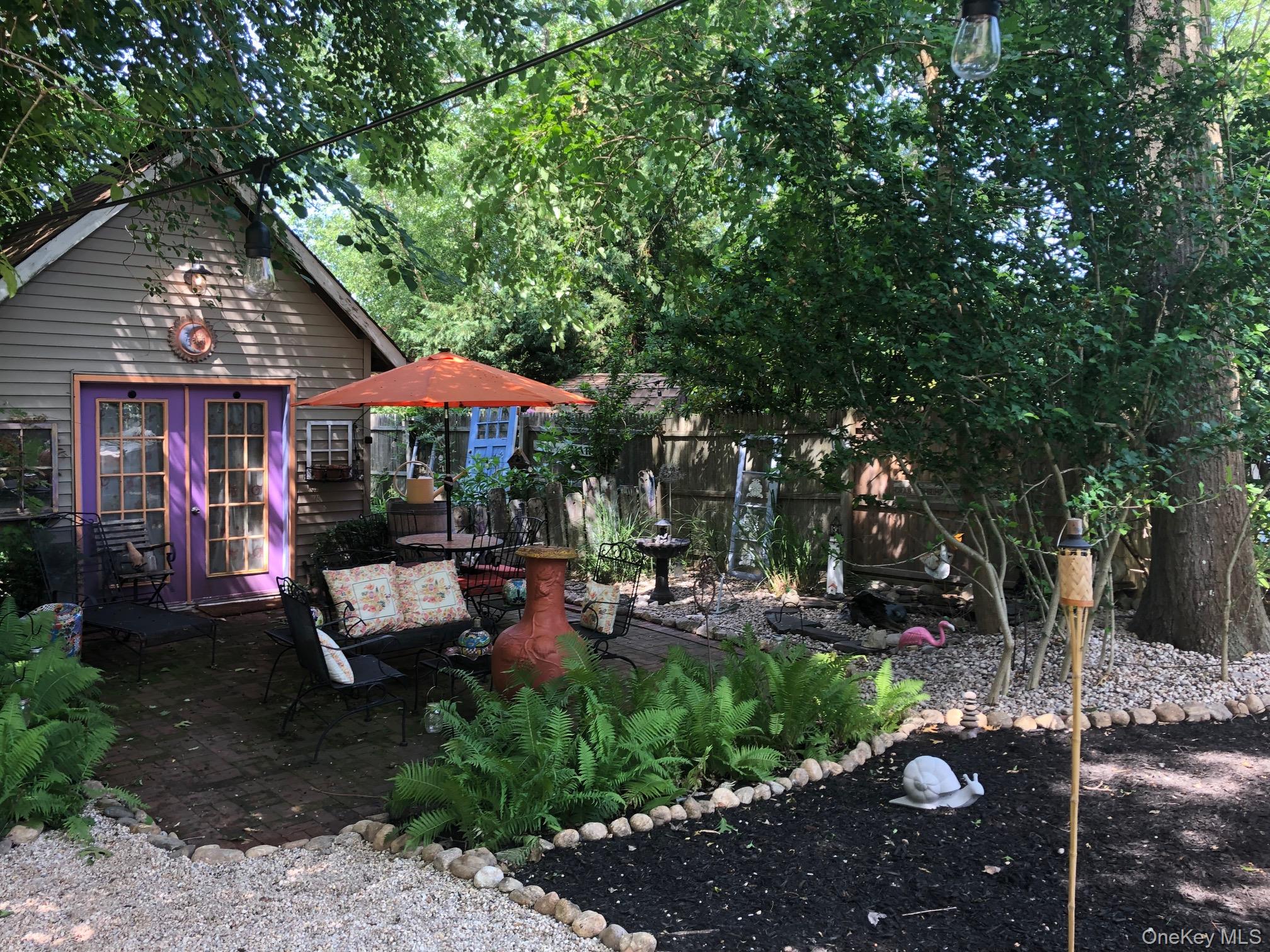 70 Shell Road Rocky Point, NY 11778 - Photo 23 of 31 View of yard with a patio and french doors