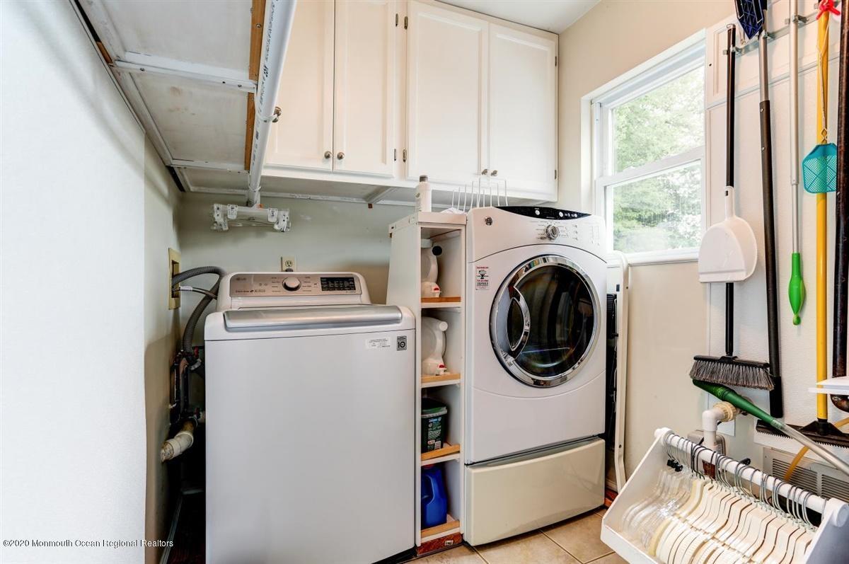 40 Hedgewood Road Howell, NJ 07731 - Photo 29 of 39 a utility room with dryer washer and a window