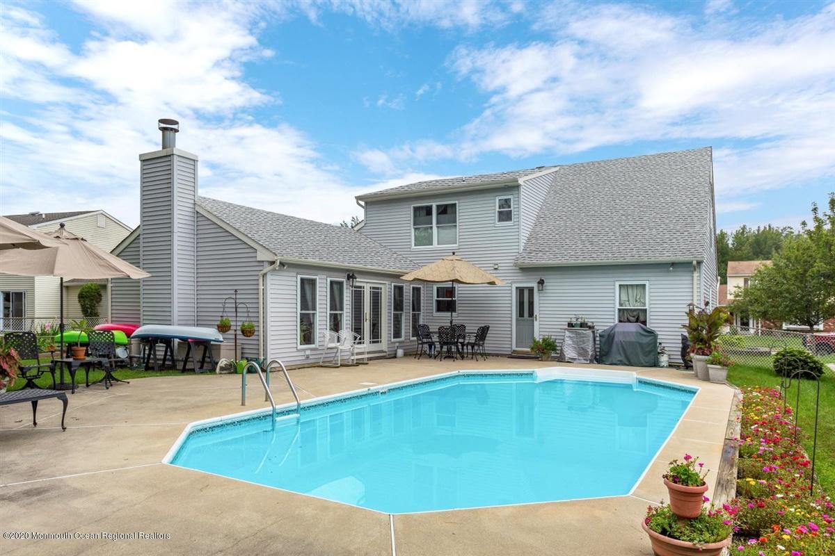 40 Hedgewood Road Howell, NJ 07731 - Photo 34 of 39 a view of a house with swimming pool and sitting area