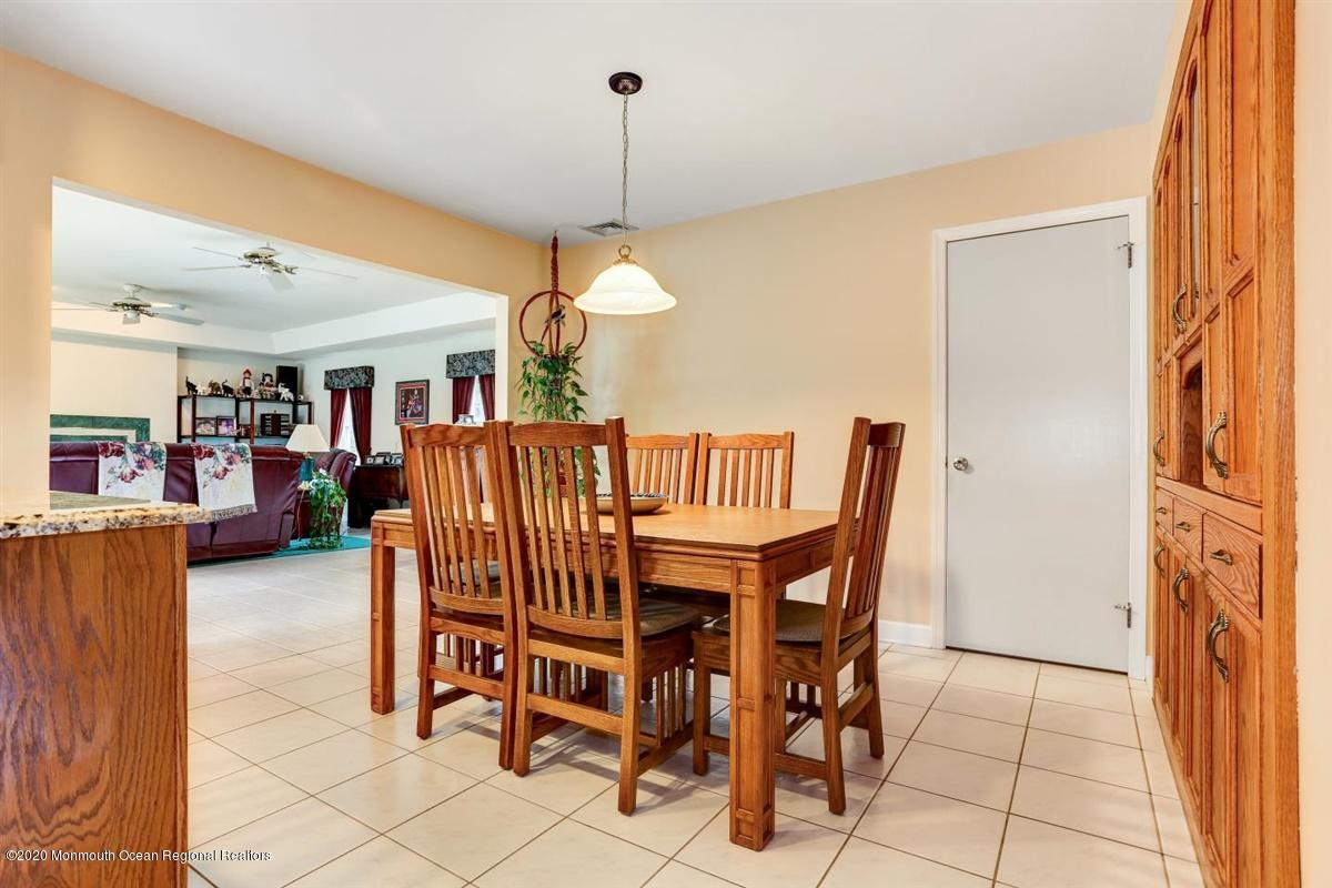 40 Hedgewood Road Howell, NJ 07731 - Photo 9 of 39 a view of a dining room with furniture and a chandelier