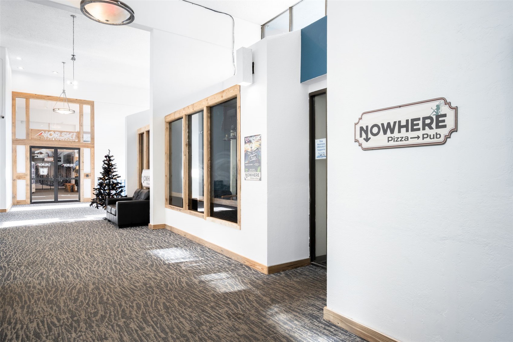 760 Copper Road, Unit F204 Copper Mountain, CO 80443 - Photo 27 of 32 Hallway with dark carpet and a high ceiling