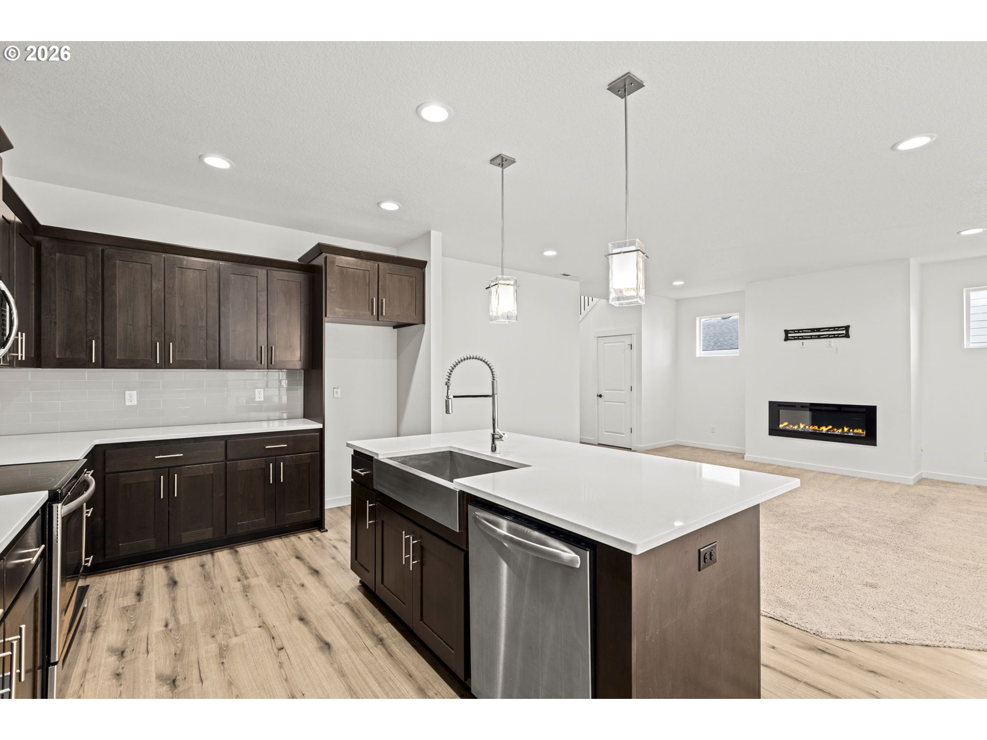 3513 Northeast Claire Road Estacada, OR 97023 - Photo 14 of 42 a kitchen with a sink a stove a refrigerator and wooden cabinets
