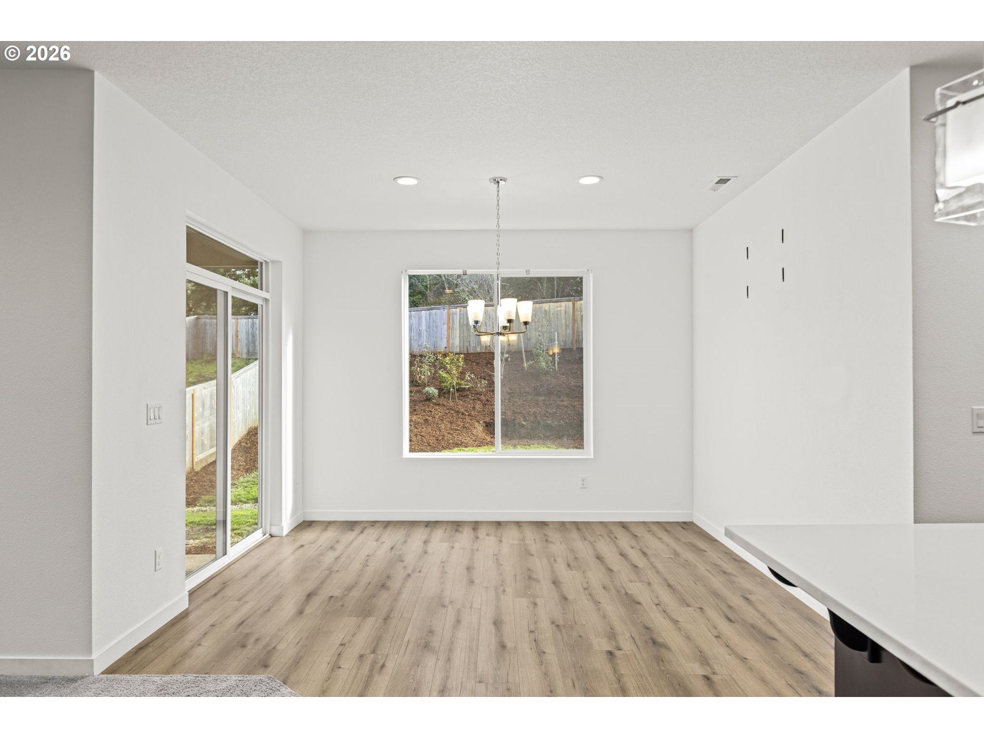 3513 Northeast Claire Road Estacada, OR 97023 - Photo 17 of 42 a view of an empty room with wooden floor and a window