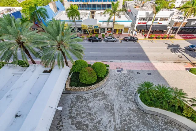 a living room with furniture a chandelier and a chandelier