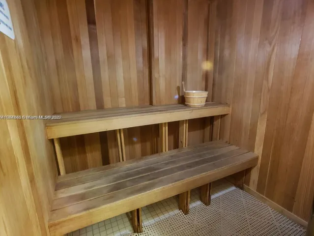 a view of a swimming pool and lounge chairs