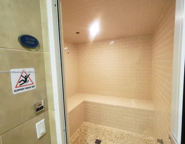 a view of swimming pool with outdoor seating and plants