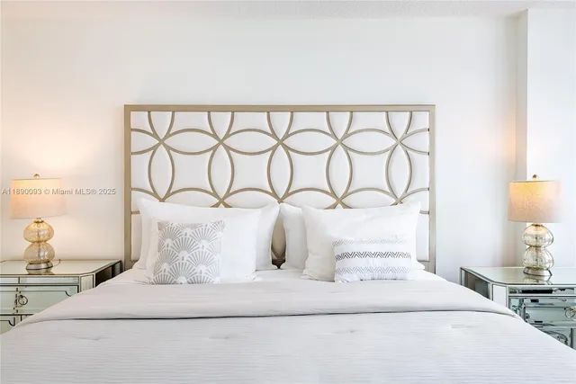 a bedroom with a bed and a night stand