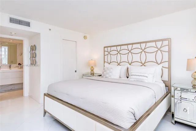a bathroom with a sink vanity tub and a mirror