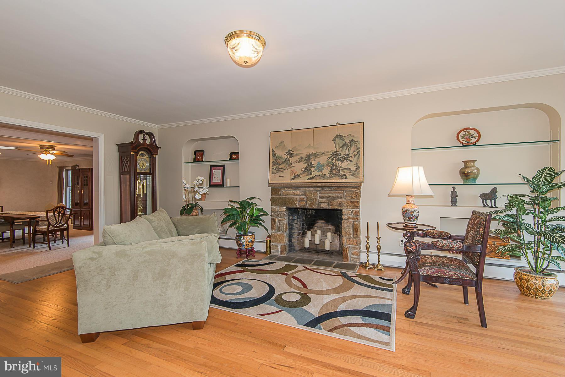 615 St Francis Road Towson, MD 21286 - Photo 3 of 30 a living room with furniture and a fireplace