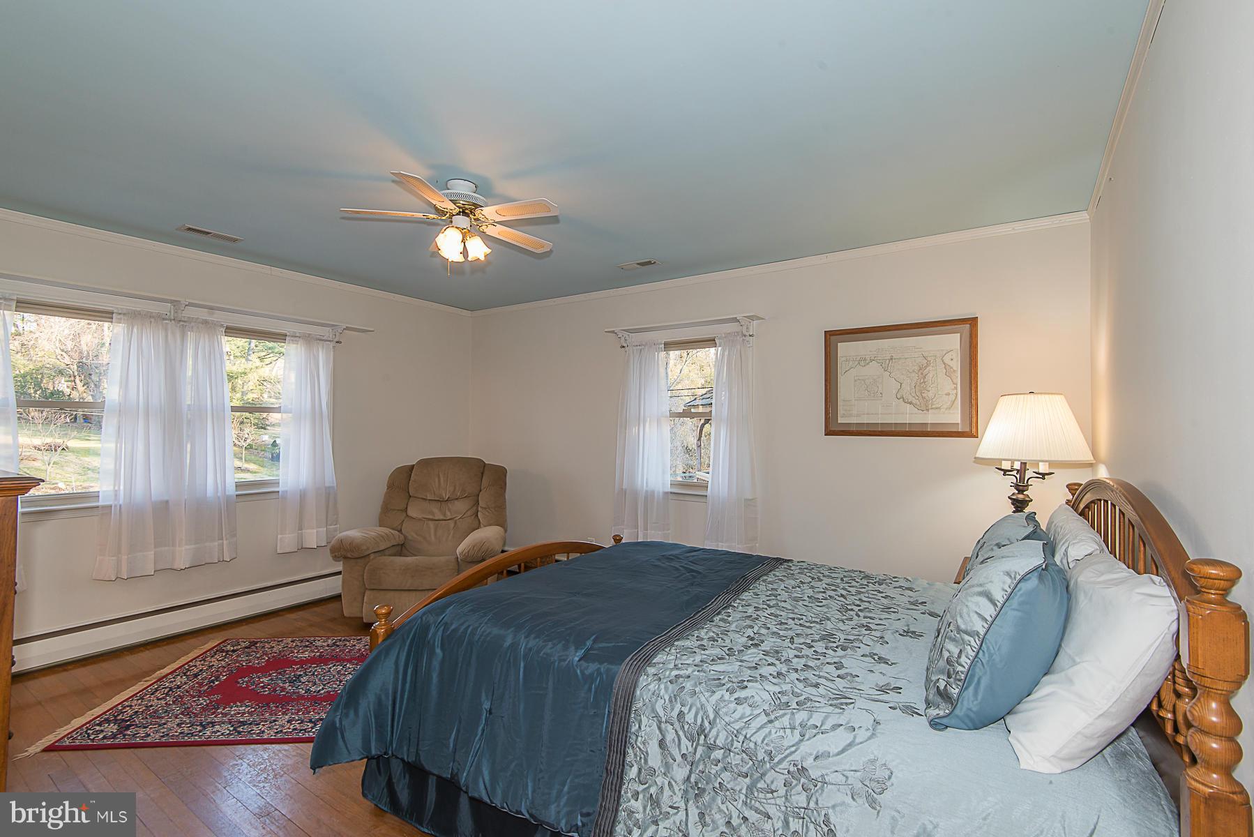 615 St Francis Road Towson, MD 21286 - Photo 22 of 30 a bedroom with a bed and wooden floor