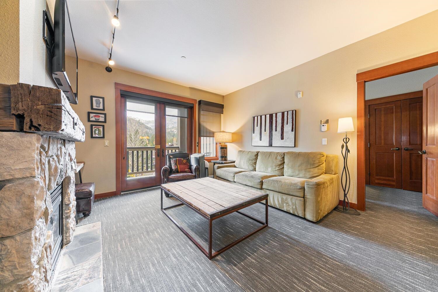 1985 Olympic Vly Road, Unit 2312 Olympic Valley, CA 96146 - Photo 20 of 27 a living room with furniture and a fireplace