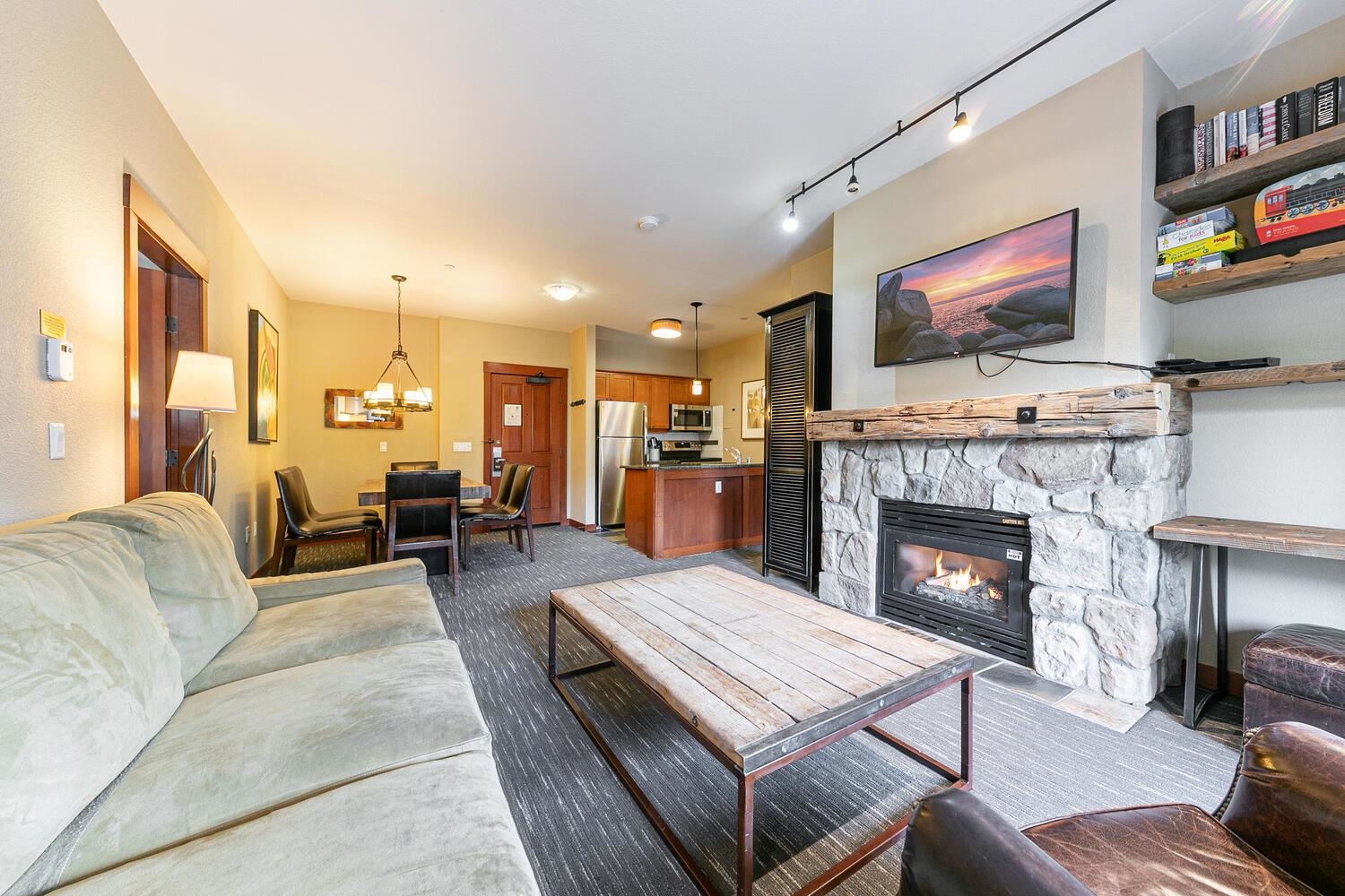 1985 Olympic Vly Road, Unit 2312 Olympic Valley, CA 96146 - Photo 22 of 27 a living room with furniture and a fireplace