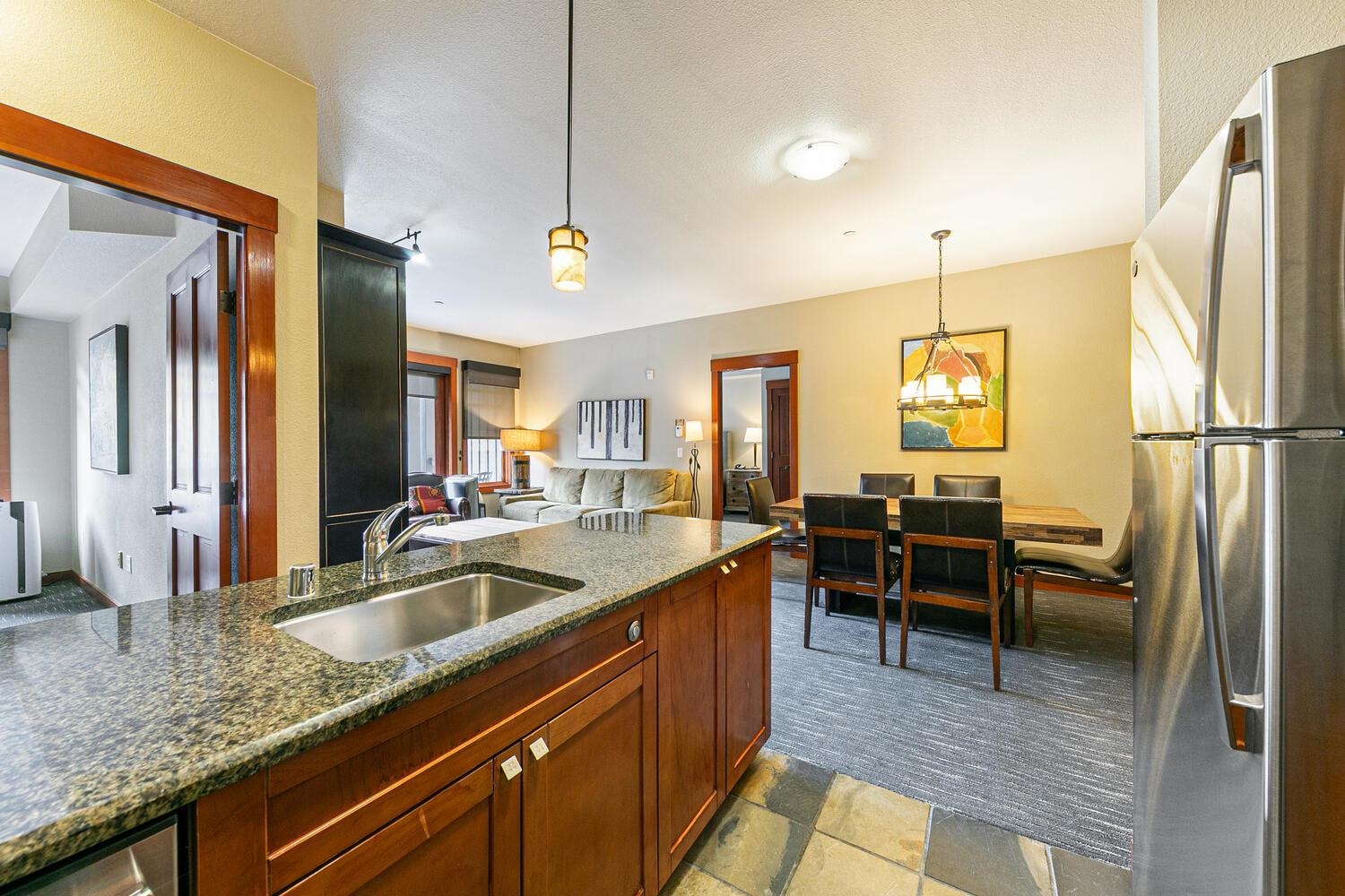 1985 Olympic Vly Road, Unit 2312 Olympic Valley, CA 96146 - Photo 4 of 27 a kitchen with sink refrigerator and cabinets