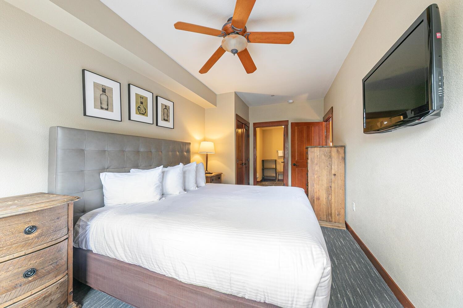 1985 Olympic Vly Road, Unit 2312 Olympic Valley, CA 96146 - Photo 7 of 27 a bedroom with a bed and a flat tv screen on dresser