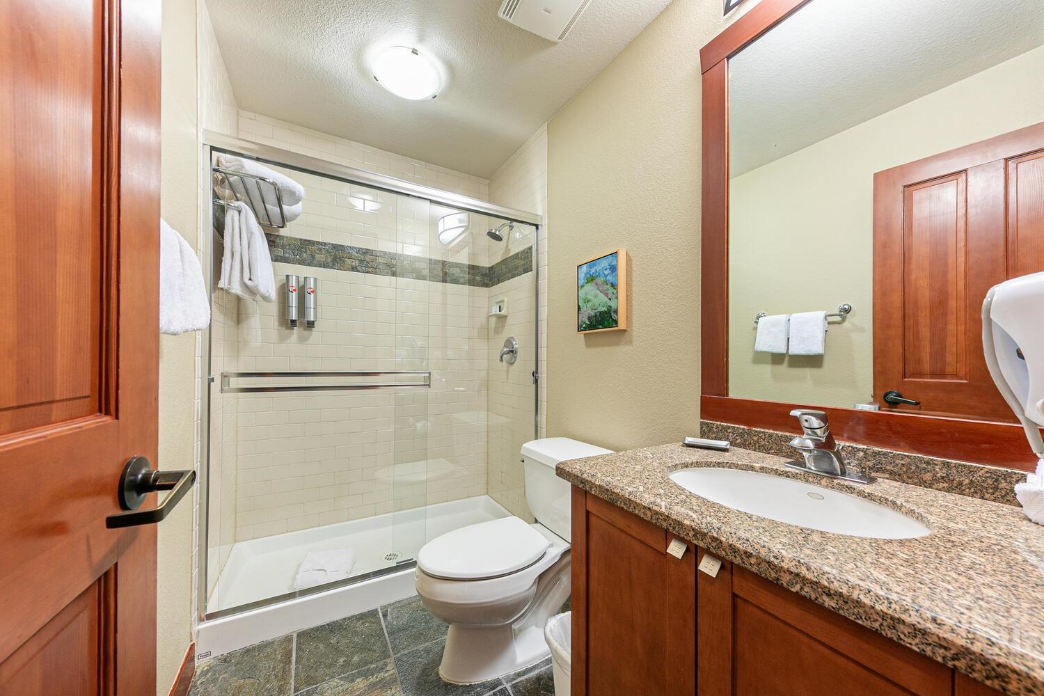 1985 Olympic Vly Road, Unit 2312 Olympic Valley, CA 96146 - Photo 8 of 27 a bathroom with a granite countertop sink toilet and shower