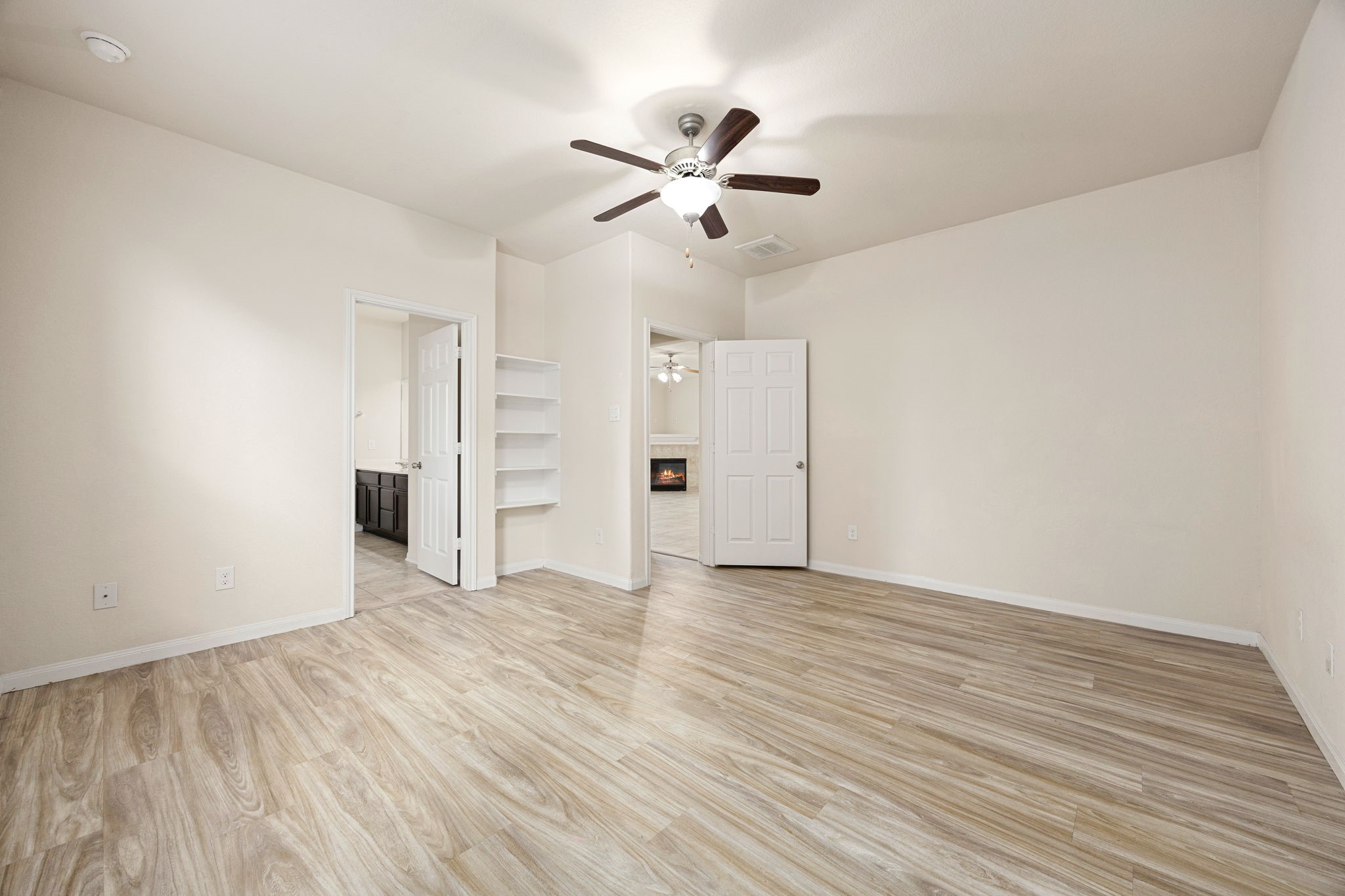 29322 Indian Clearing Spring, TX 77386 - Photo 22 of 47 a view of empty room with wooden floor and ceiling fan