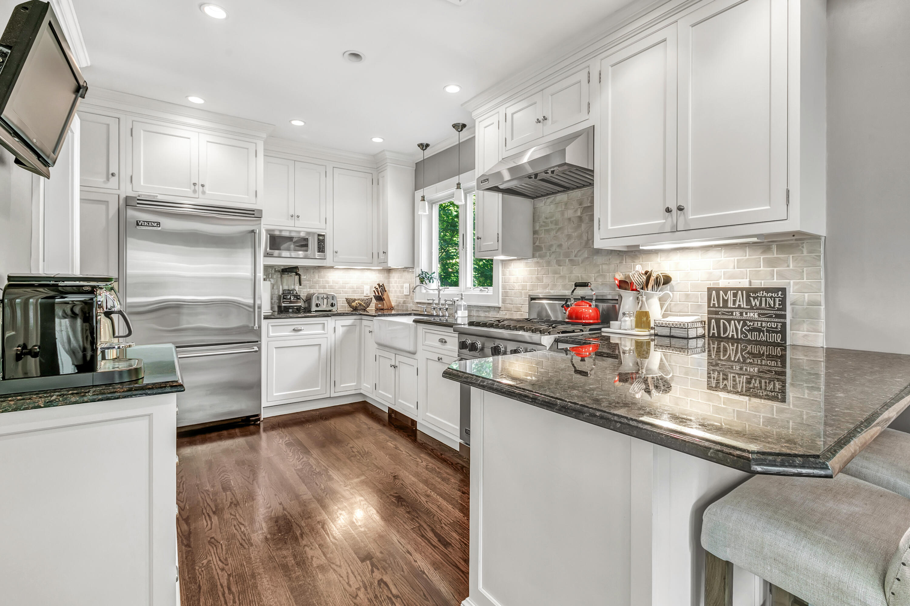 401 Jelliff Mill Road New Canaan, CT 06840 - Photo 11 of 21 a kitchen with white cabinets and appliances