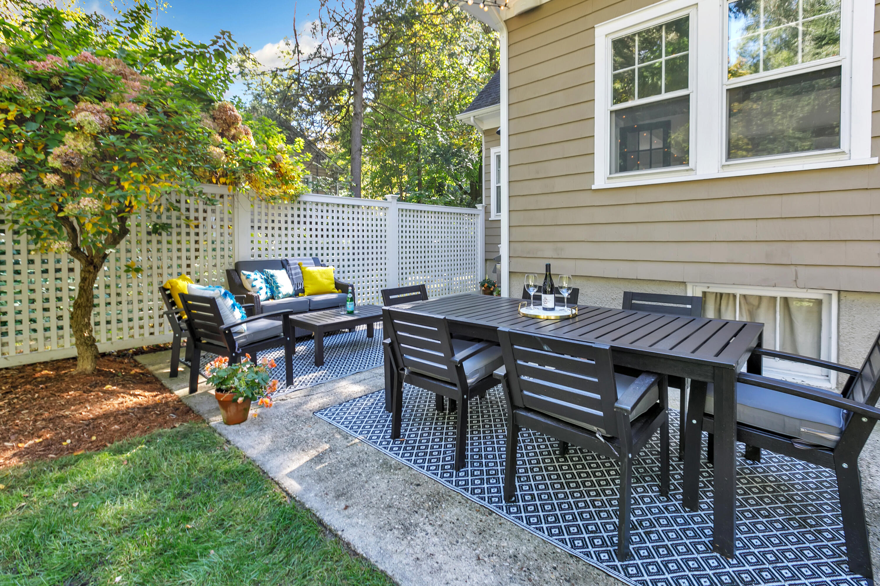 401 Jelliff Mill Road New Canaan, CT 06840 - Photo 16 of 21 a view of a dinning table and chairs in the patio