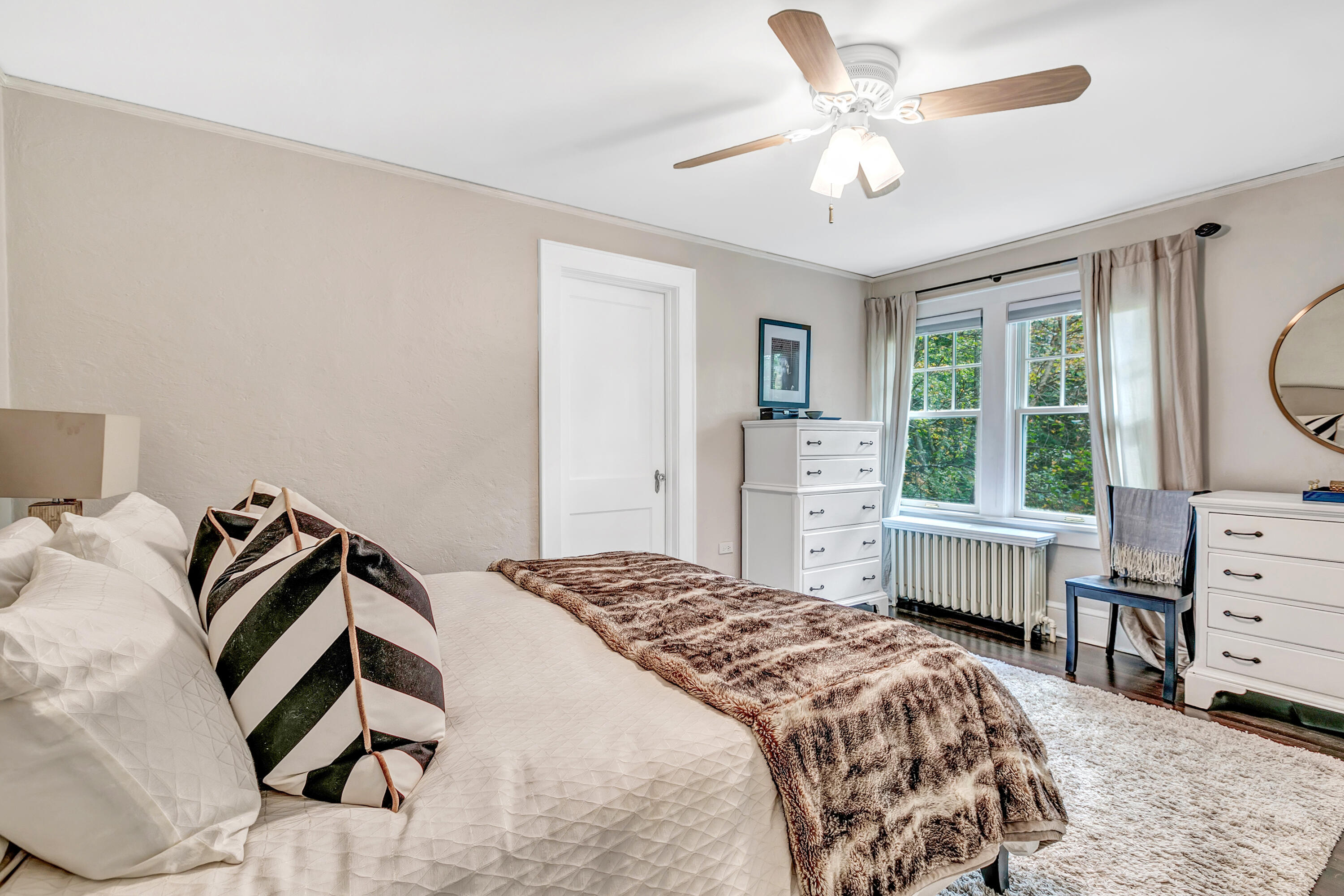 401 Jelliff Mill Road New Canaan, CT 06840 - Photo 17 of 21 a bedroom with a bed and a chandelier