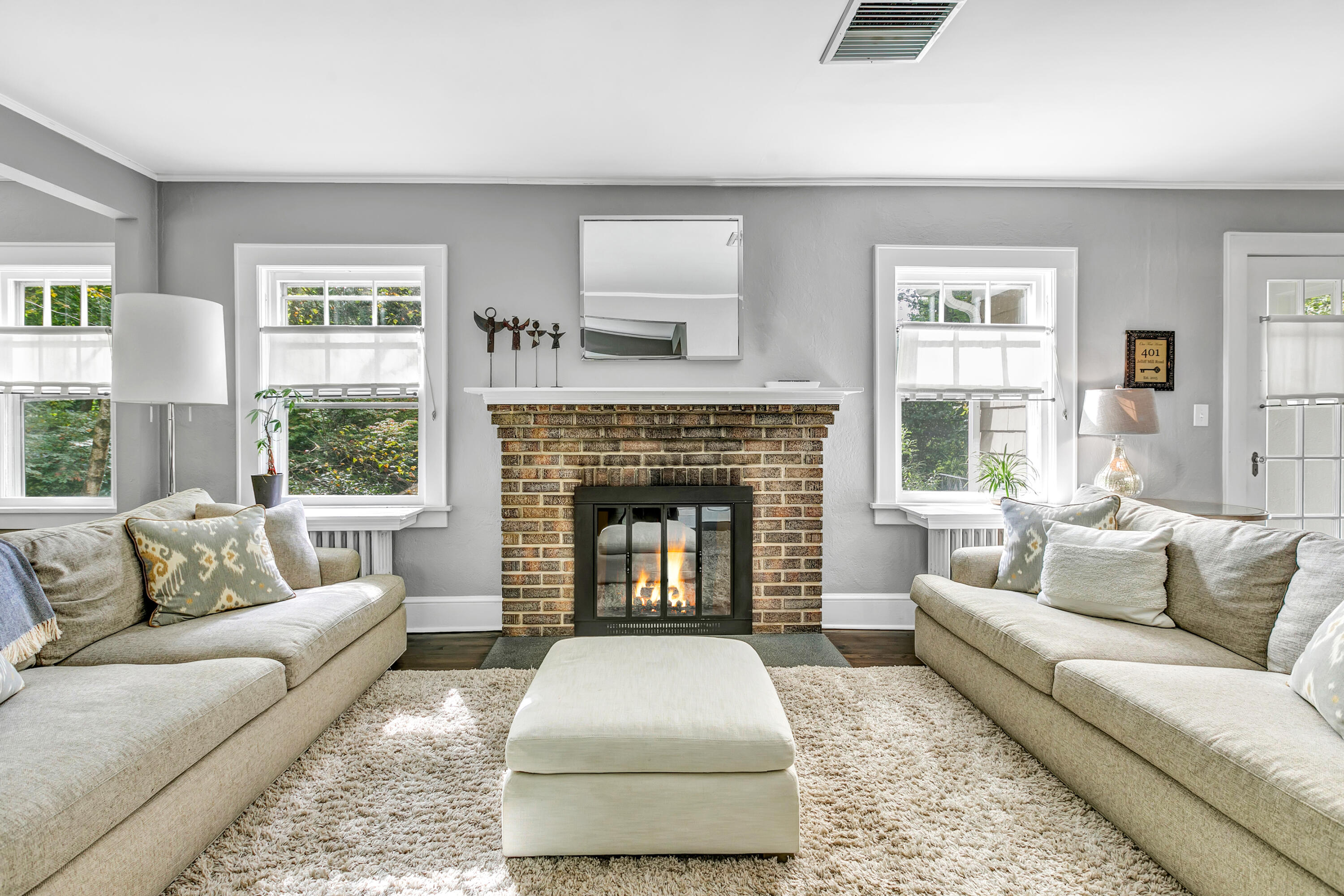 401 Jelliff Mill Road New Canaan, CT 06840 - Photo 5 of 21 a living room with furniture and a fireplace