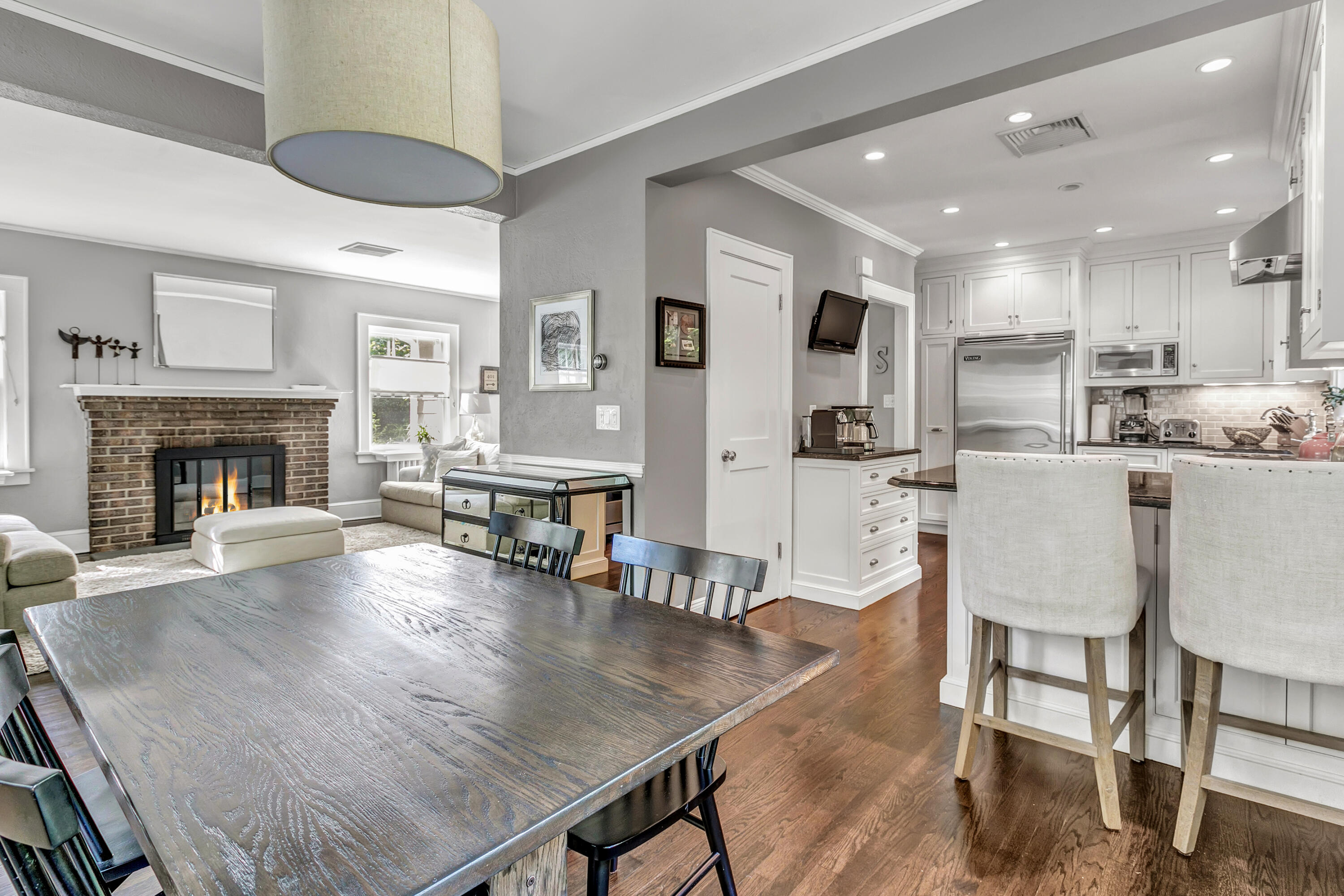 401 Jelliff Mill Road New Canaan, CT 06840 - Photo 10 of 21 a living room with stainless steel appliances furniture a fireplace a rug and kitchen view