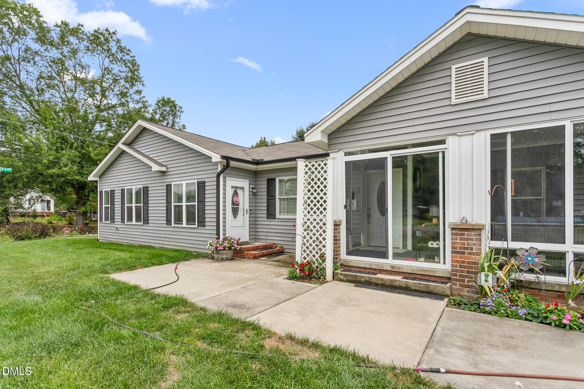 3163 Saul Loop Road Elon, NC 27244 - Photo 5 of 44 a front view of house with a garden and patio