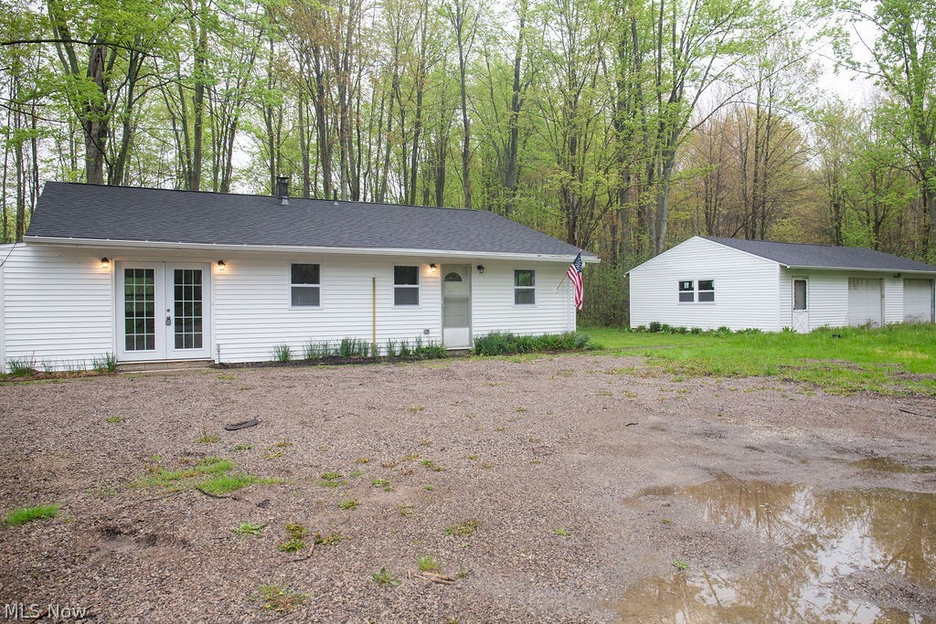 3644 Padanarum Road Geneva, OH 44041 - Photo 16 of 19 Single-story residence featuring white vinyl siding and a dark shingle roof