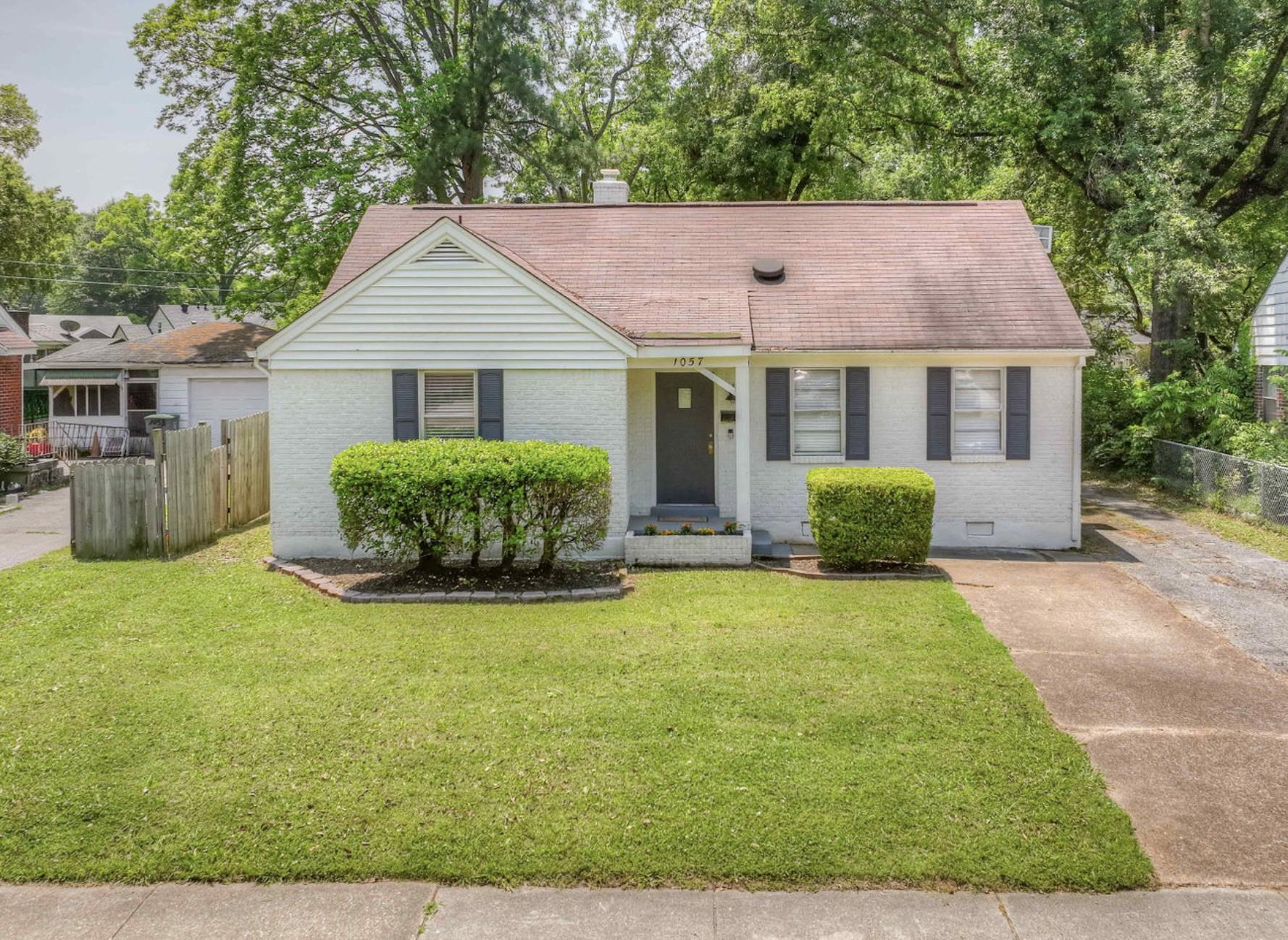 1057 Waring Road Memphis, TN 38122 - Photo 1 of 1 a view of a house with backyard and garden