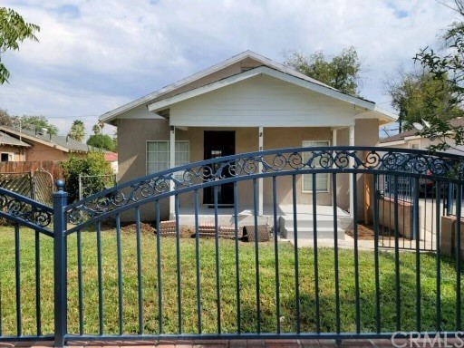 2771 Pleasant Street Riverside, CA 92507 - Photo 1 of 1 a front view of house and yard with green space