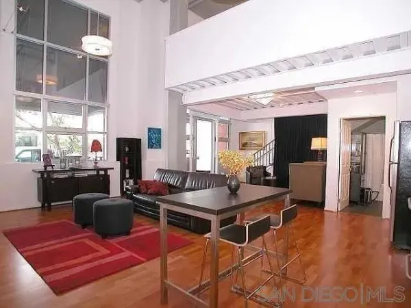 a dining room with furniture and a flat screen tv