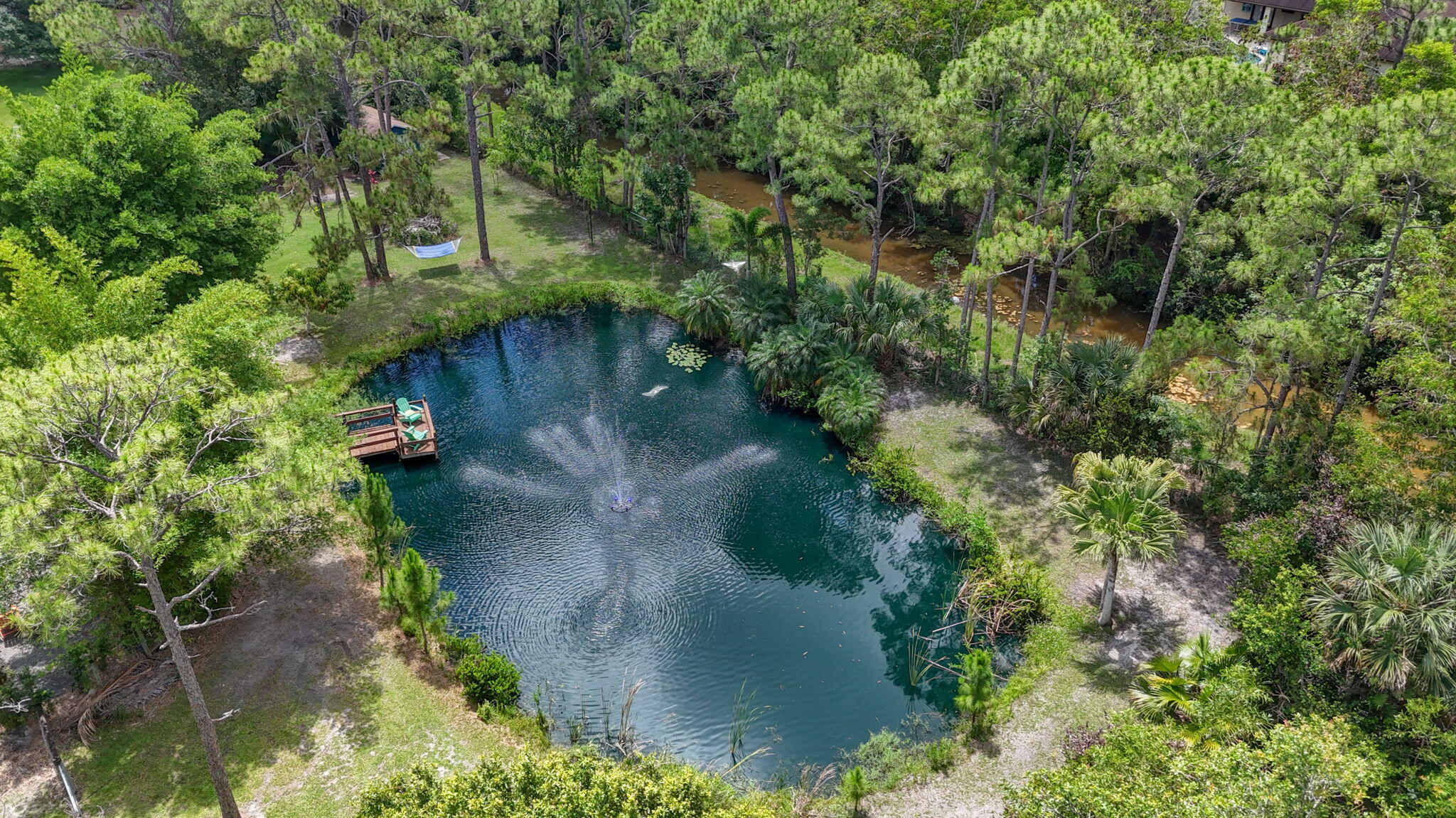 12558 165th Road North Jupiter, FL 33478 - Photo 56 of 67 an aerial view of a house with a yard