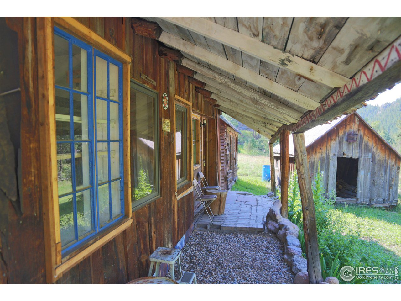 9648 Highway 36 Lyons, CO 80540 - Photo 18 of 31 a view of a porch with a backyard