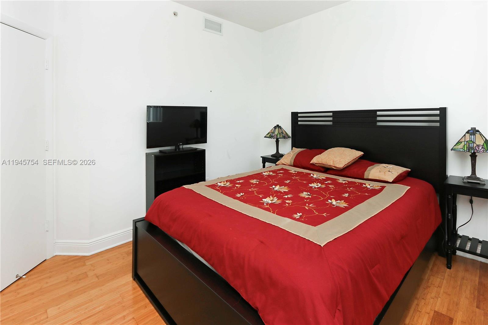 7275 Southwest 89th Street, Unit B416 Miami, FL 33156 - Photo 13 of 32 a bedroom with a bed and a black countertop