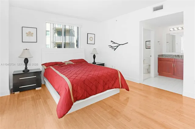 a bedroom with a bed and a dresser