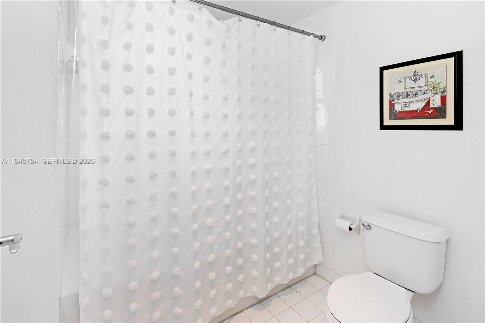 7275 Southwest 89th Street, Unit B416 Miami, FL 33156 - Photo 16 of 32 a white toilet sitting next to a white wall