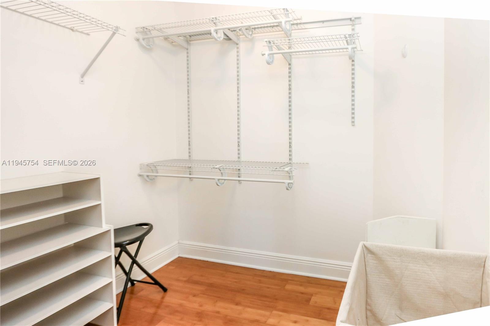 7275 Southwest 89th Street, Unit B416 Miami, FL 33156 - Photo 17 of 32 a view of a room with racks on the wall